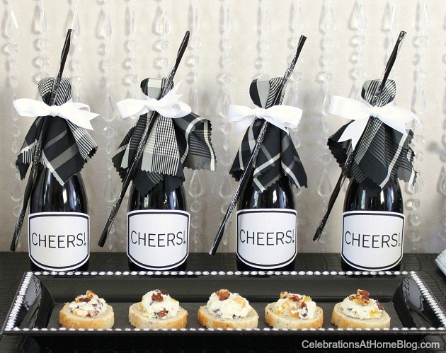 mini champagnes topped with fabric & ribbon & straw