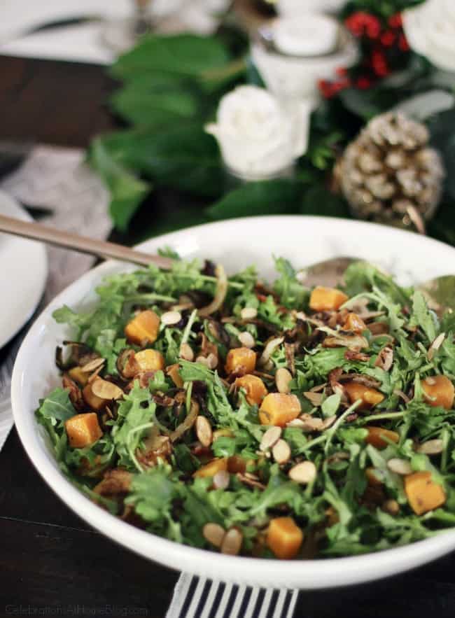 Butternut Squash Baby Kale Salad is a must-make winter salad for your entertaining menu. Make this part of your Thanksgiving side dishes or Christmas dinner too.  #salad #sidedish #Thanksgiving #Christmas 