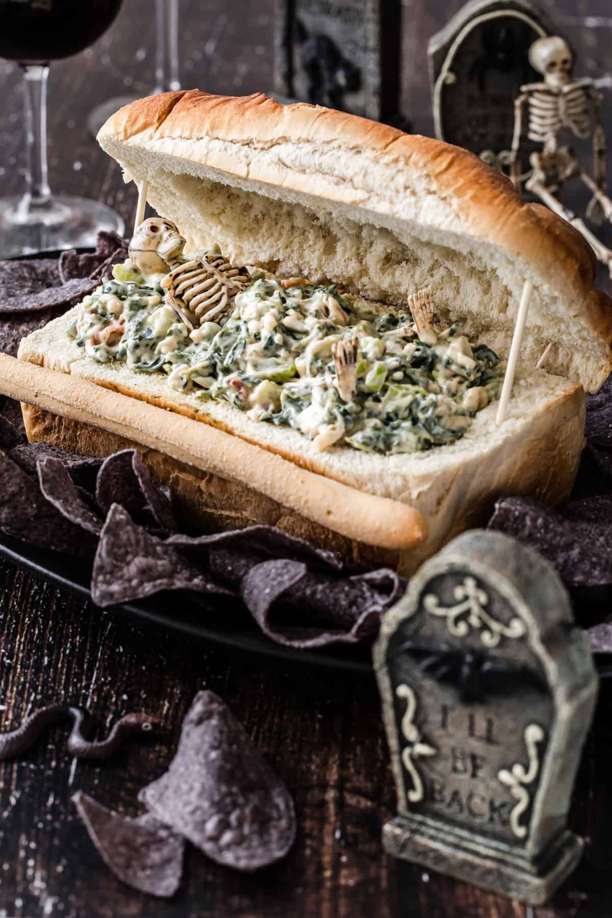 halloween dip in coffin bread bowl with mini tombstone decoration