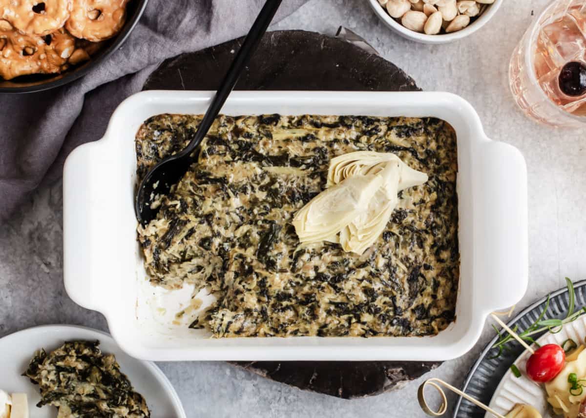 baked spinach dip in white dish.