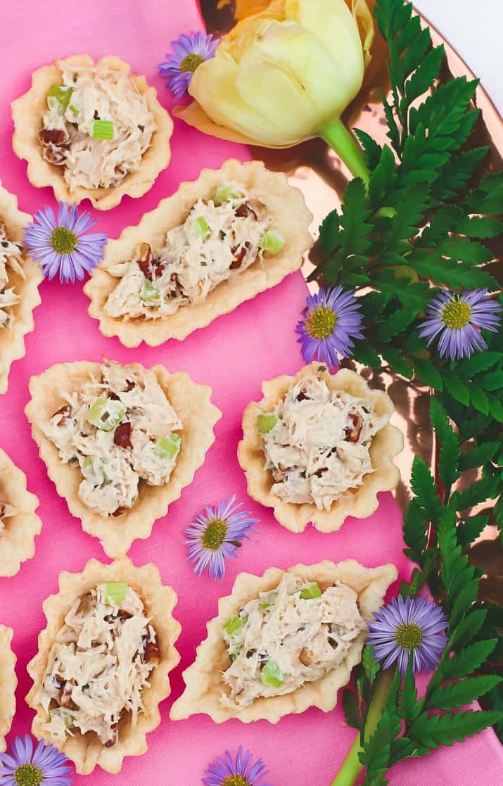 honey chicken salad cups party food, on pink background