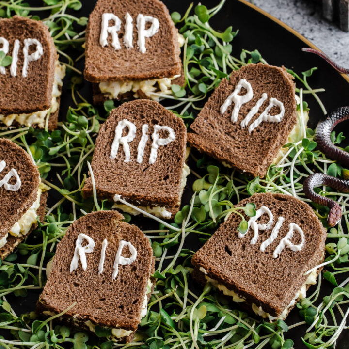 small sandwiches cut and decorated like tombstones for halloween.
