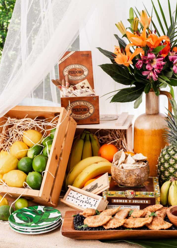wood crates used for buffet display in tropical themed party, filled with fruit.