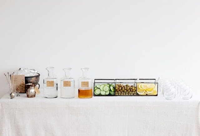 table set up with water and garnishes.