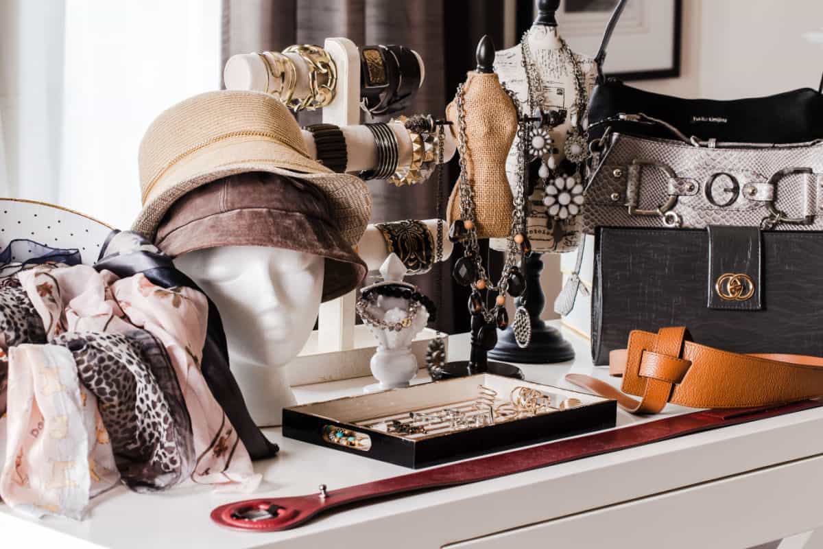 white table set up with women's fashion accessories for a swap party.