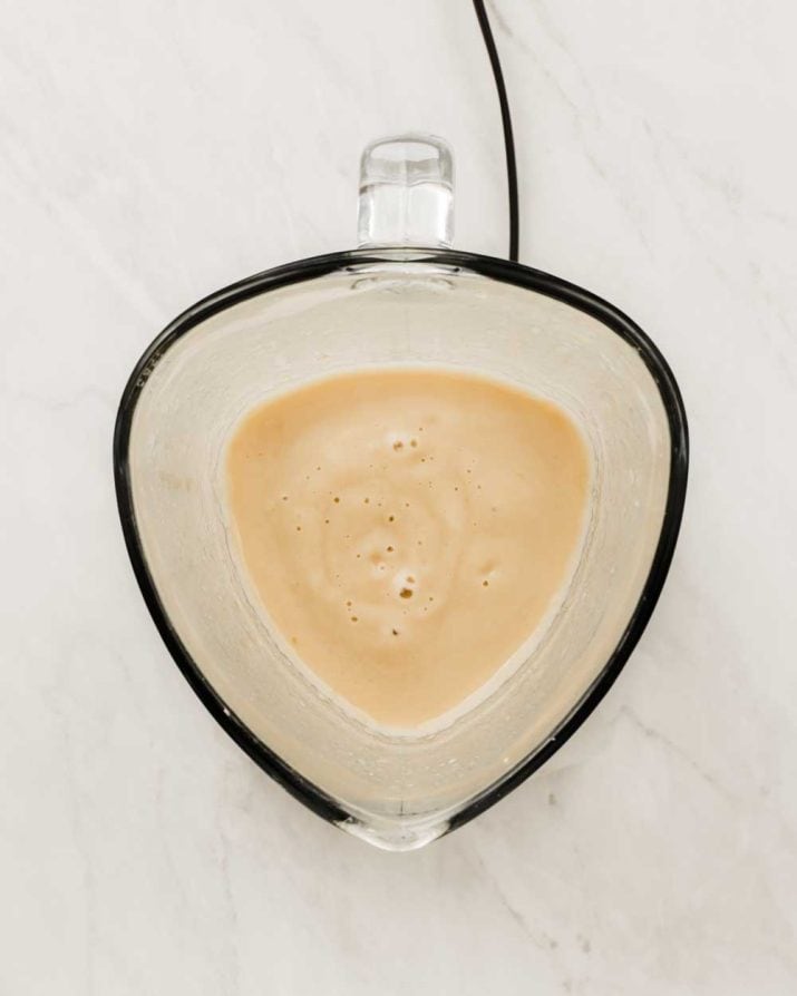 smooth blended white soup in blender.