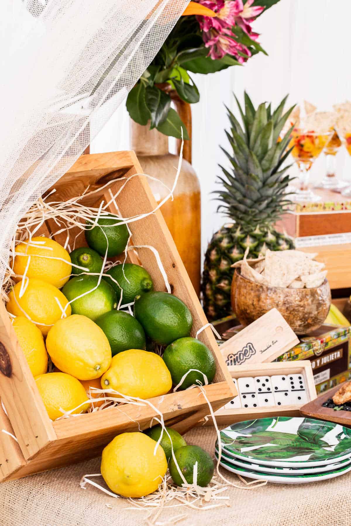 buffet table with crate of lemons and limes.