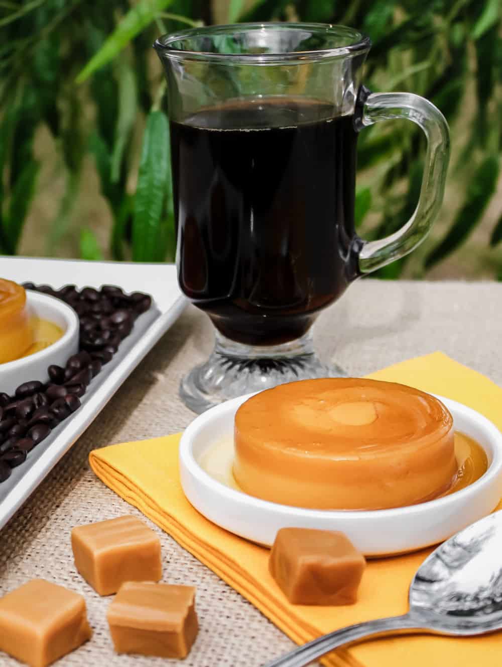 caramel flan with mug of coffee.