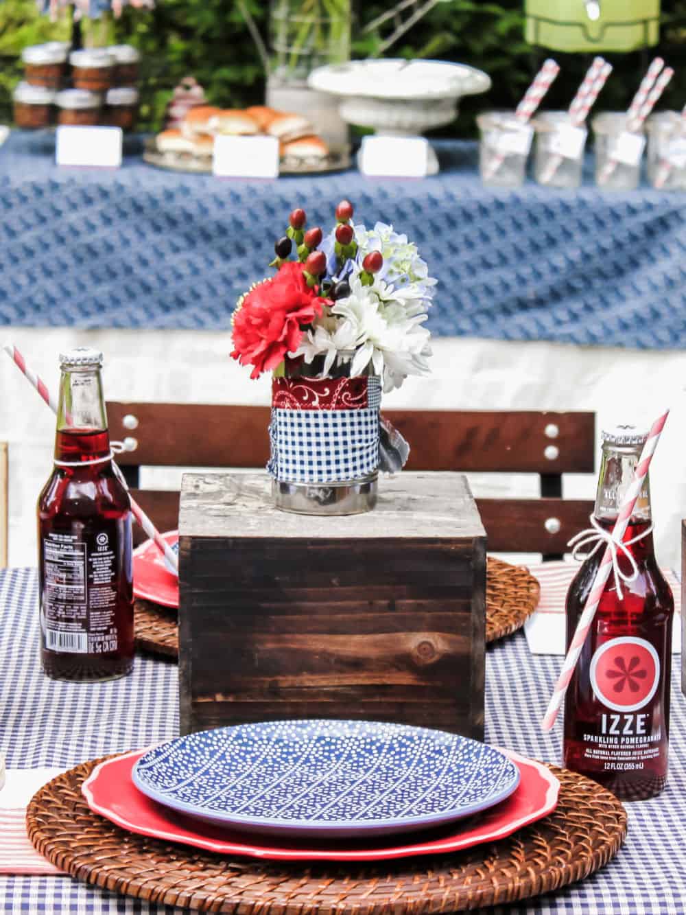 red and blue place setting on outdoor table.