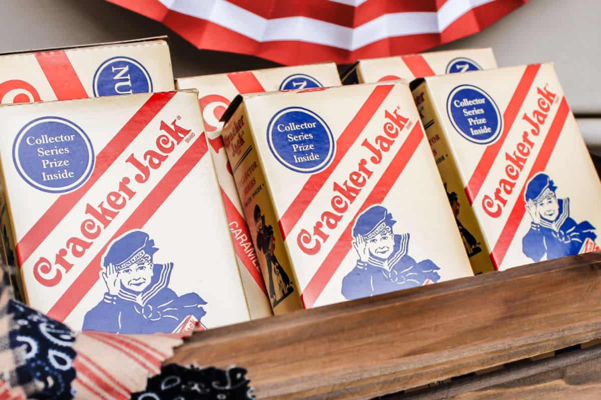 vintage style Cracker Jack boxes displayed in wood box. 
