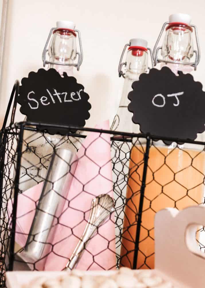 flip top bottles of juice and water in wire basket.