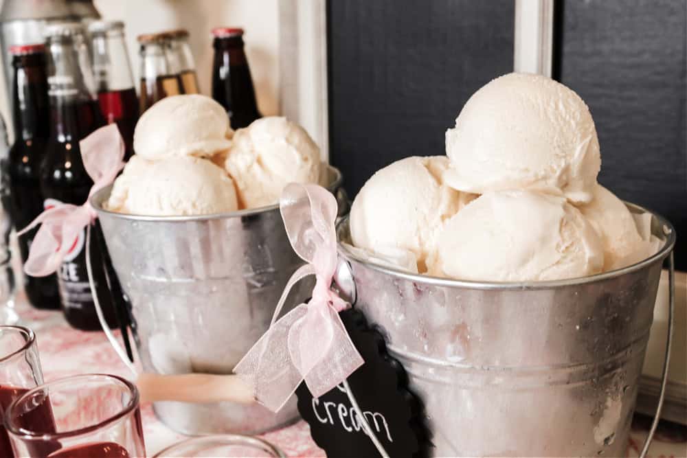 vanilla ice creams scoops in small buckets.