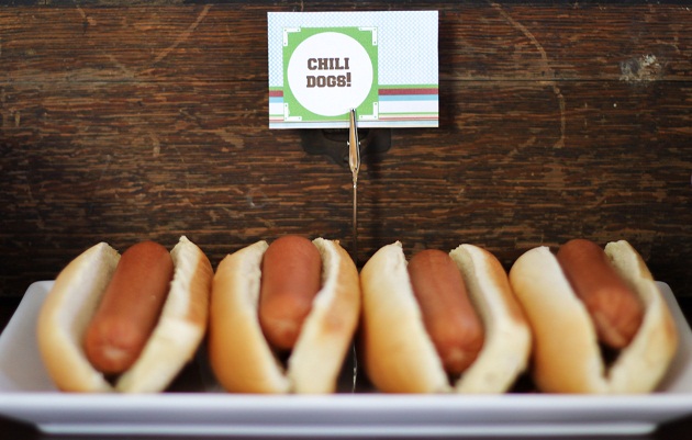 Hot dogs on plate with food name tag
