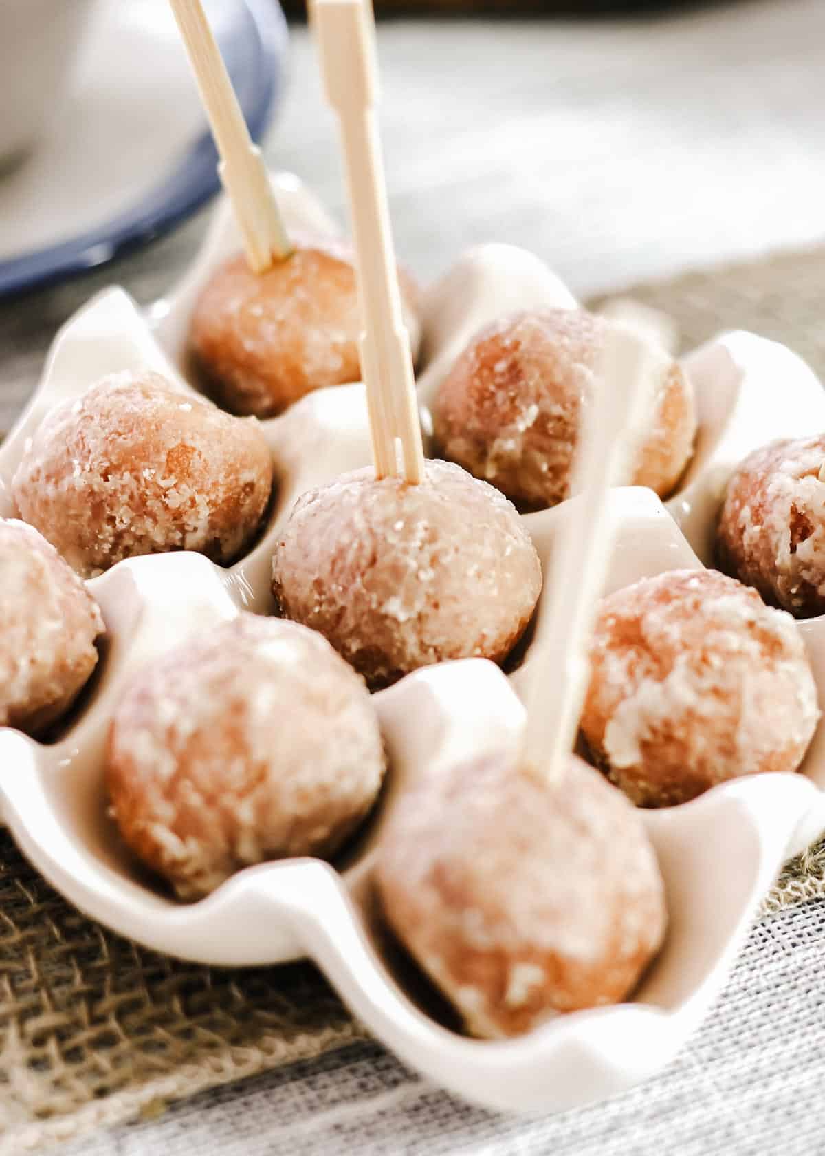 donut holes displayed in egg dish.