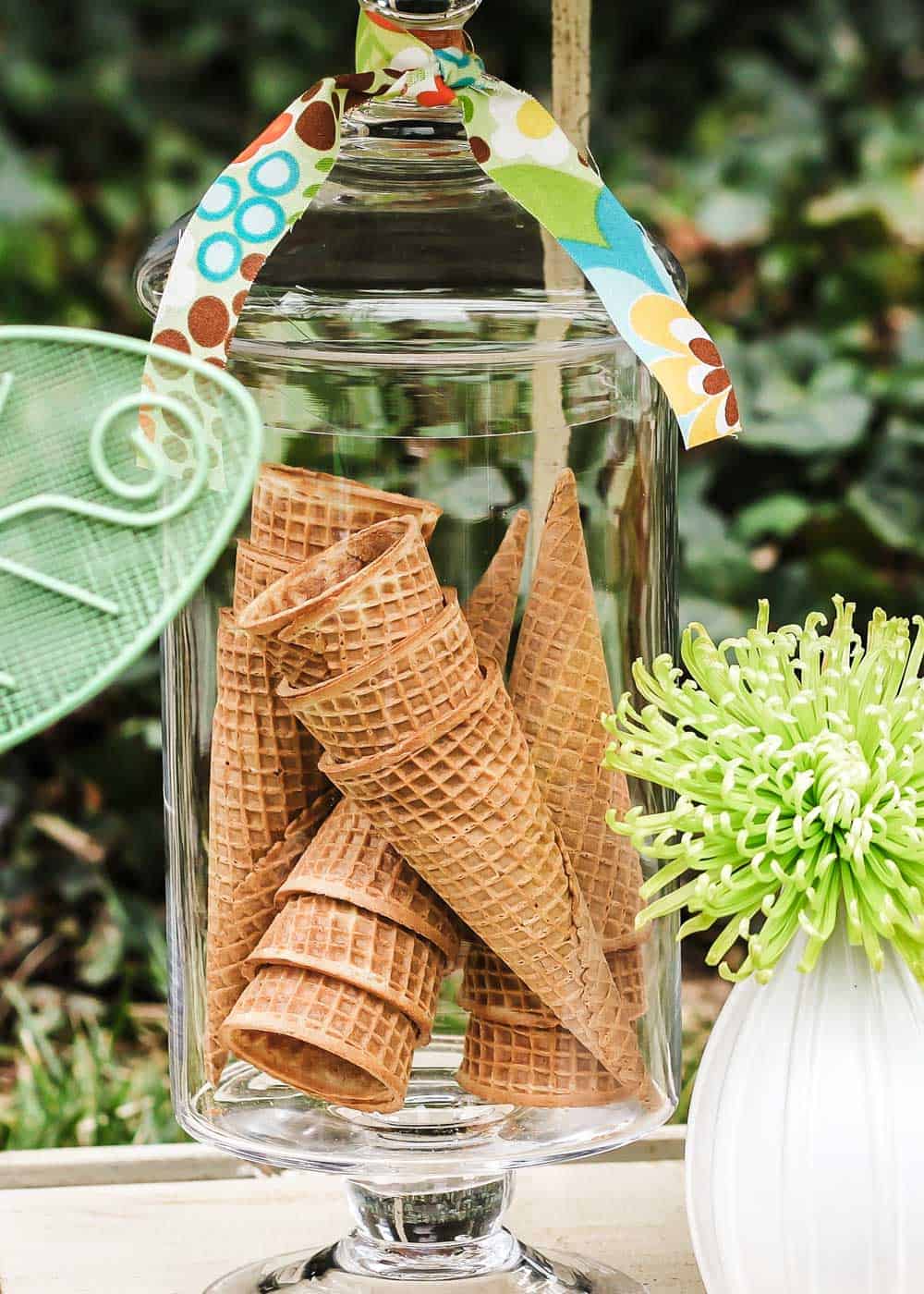 ice cream cones displayed in apothecary jar.