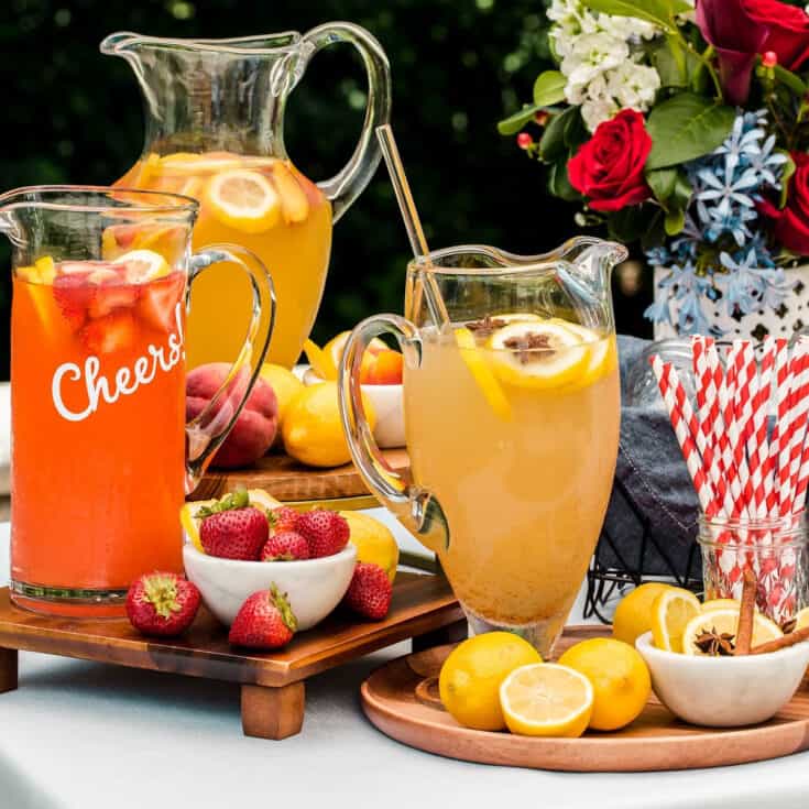 Lemonade juice jug and glass with orange fruit. Refreshing drink