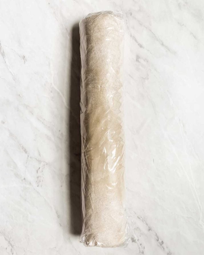 rolled up pastry in plastic wrap.