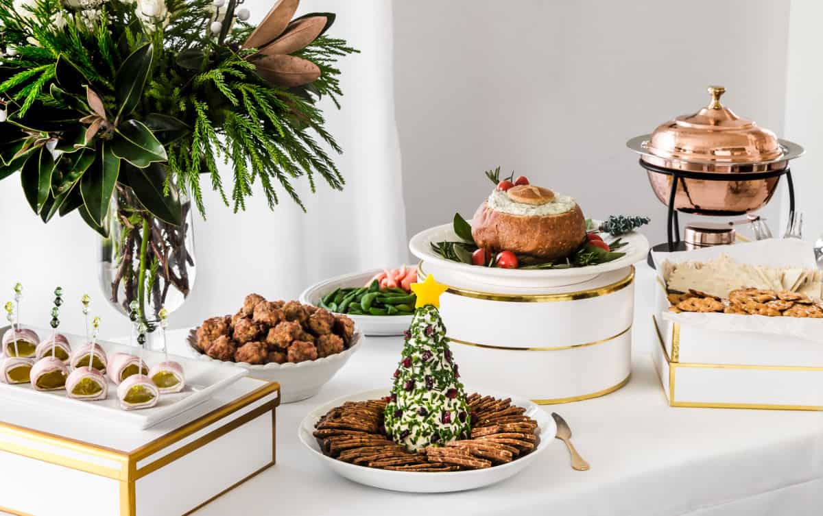 appetizers buffet on white table.