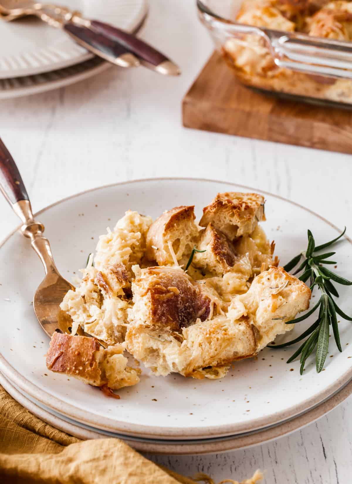 savory bread pudding on white plate