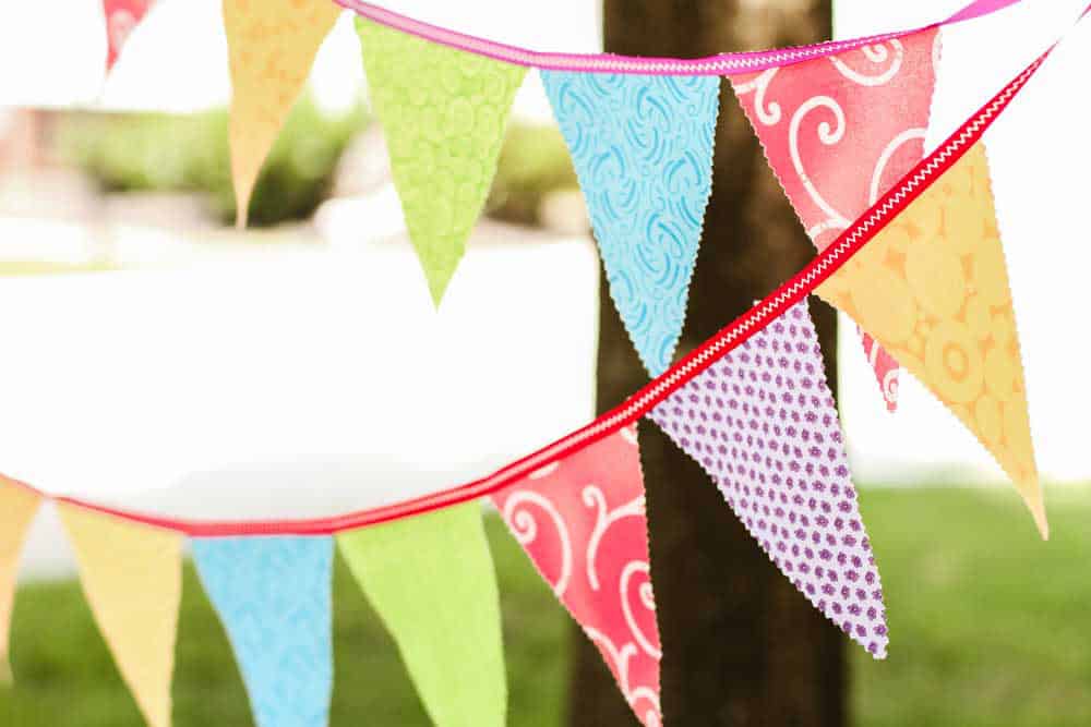 colorful fabric bunting hanging outside. 