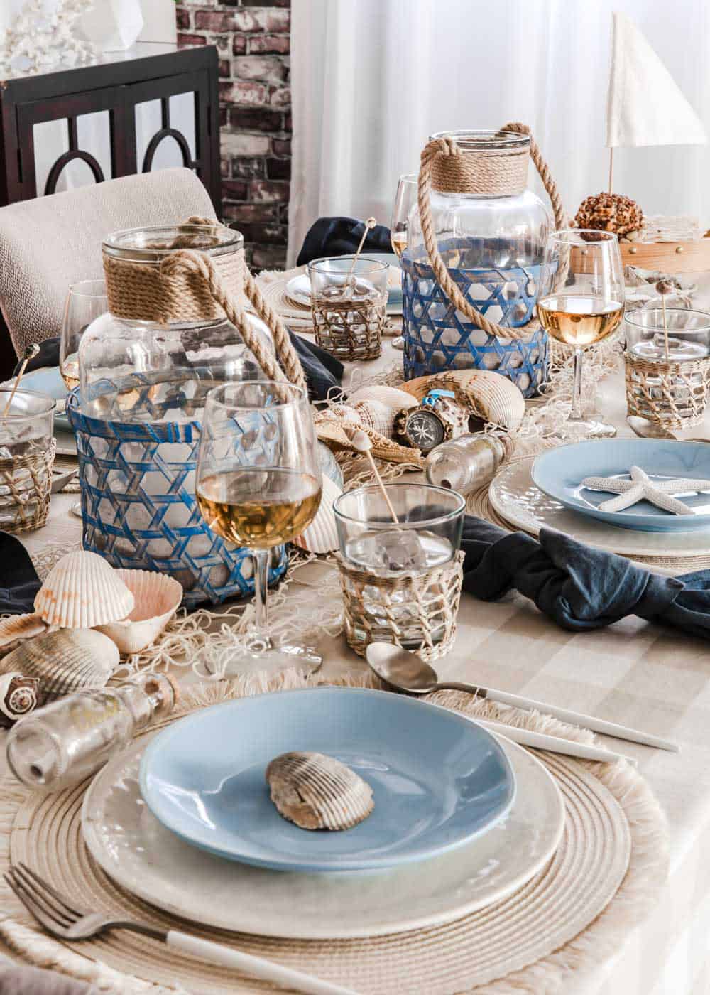 light blue and tan nautical themed tablescape in dining room.