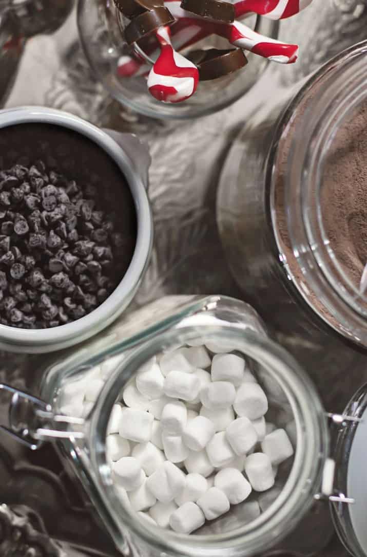 how to set up a hot cocoa bar with ingredients on silver tray