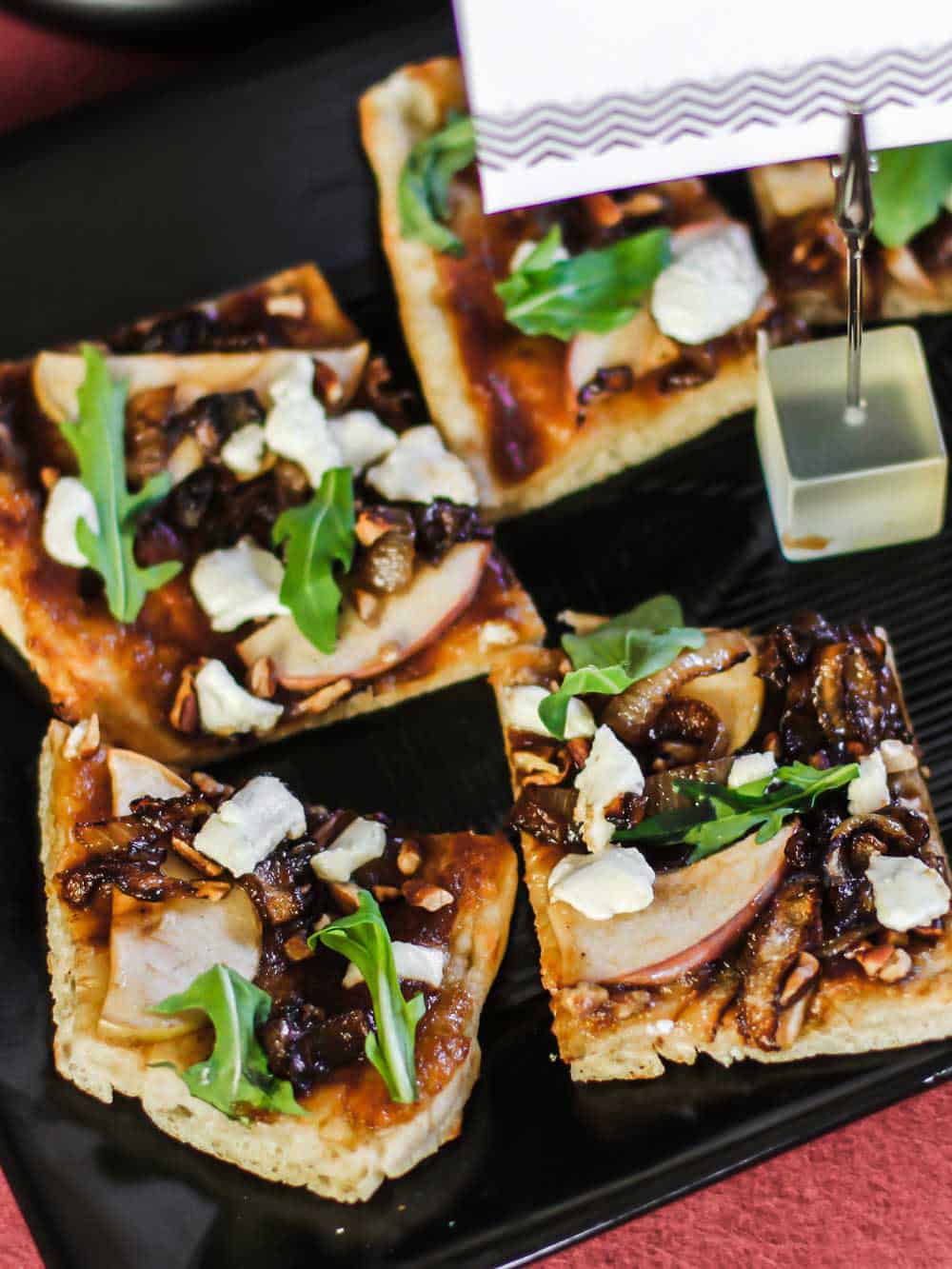 pizza squares with apple slices, goat cheese, and arugula.