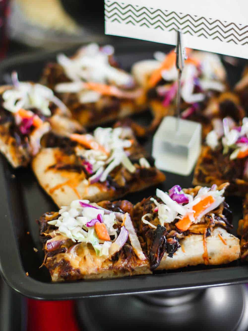 shredded barbecue beef pizza with slaw topping.