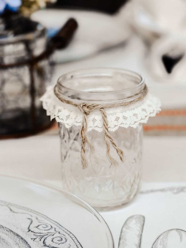 jar used as drinking glass, wrapped with lace ribbon and twine.
