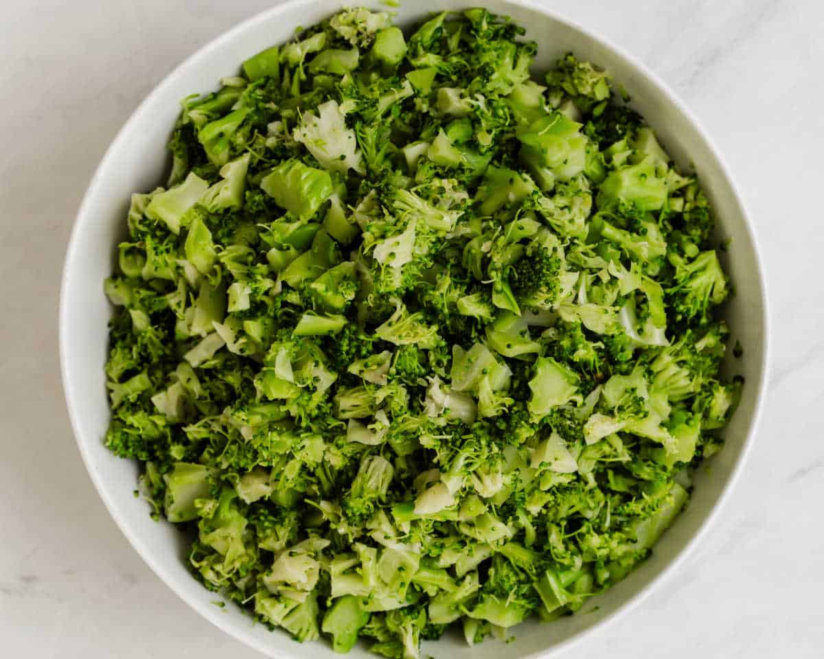 chopped broccoli in white bowl.