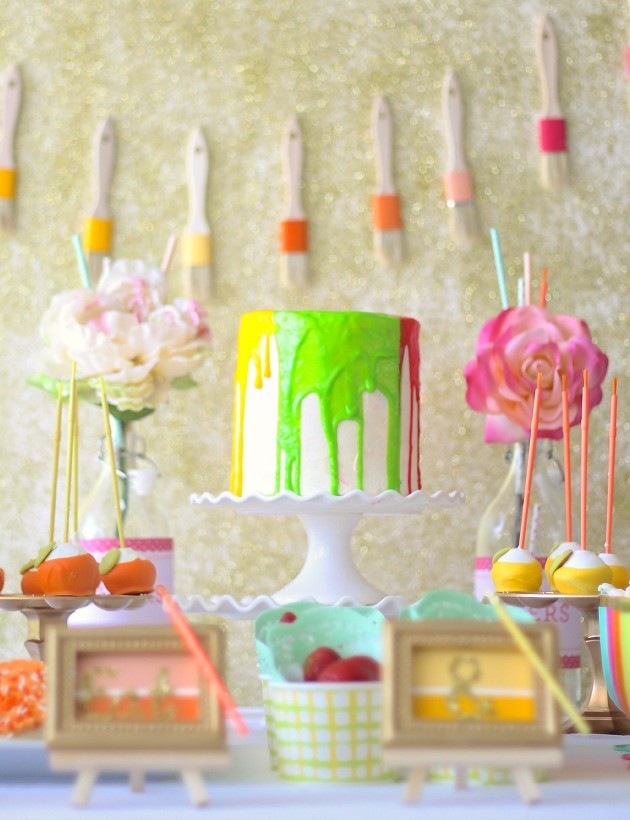 paint themed cake with frosting looking like dripping paint.