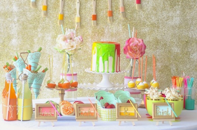 dessert table with food and decor in a Paint theme.