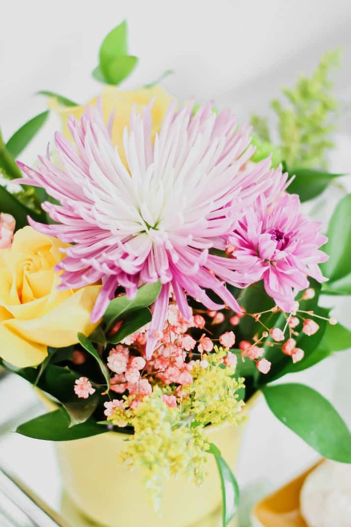 flowers in yellow pot