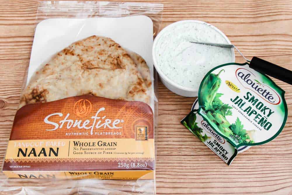 package of naan and spreadable cheese on tabletop.
