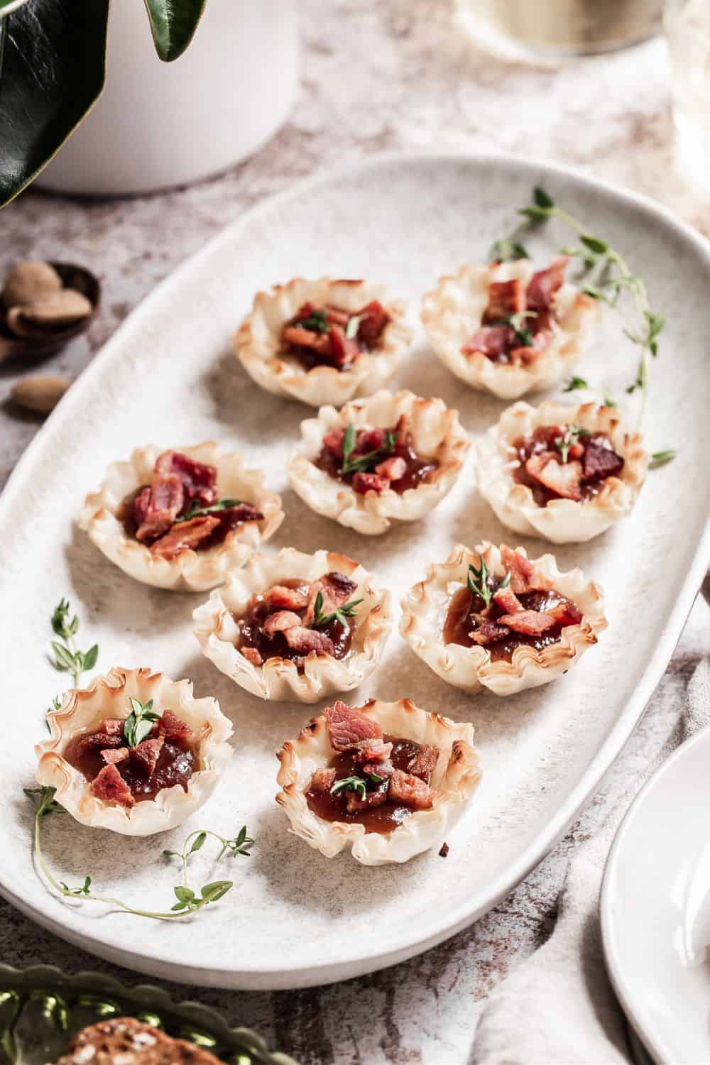 phyllo cup appetizers on white tray