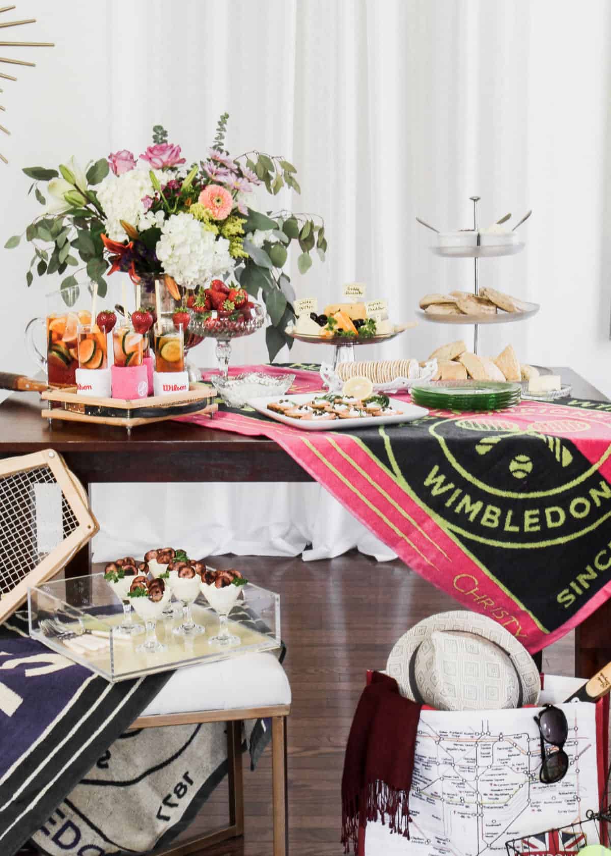 Wimbledon theme party table with tennis decor and brunch food.