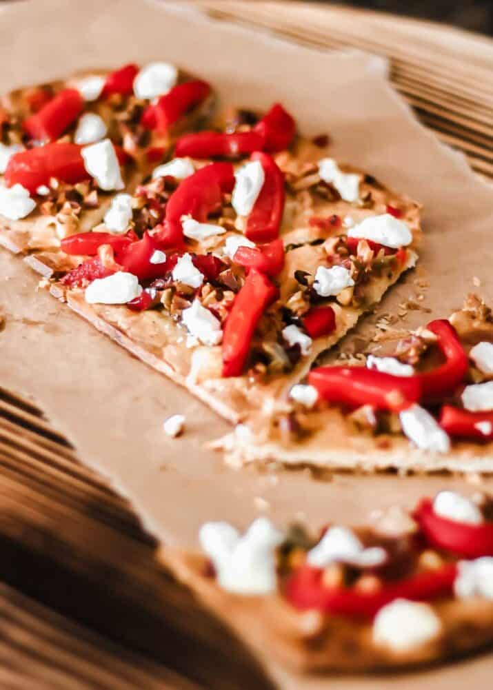 thin crust pizza with olive tapenade, red peppers and goat cheese.