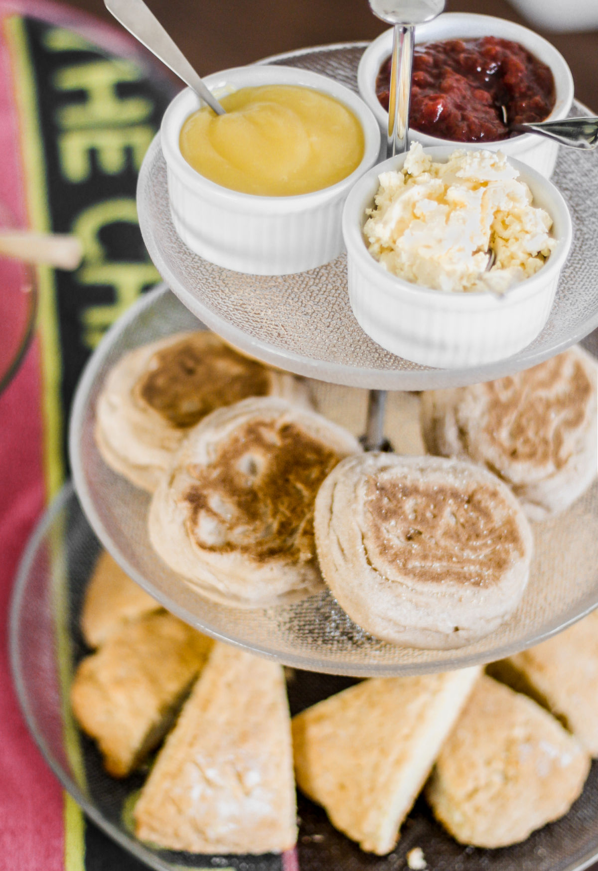 3 tiered server with scones, crumpets and condiments.