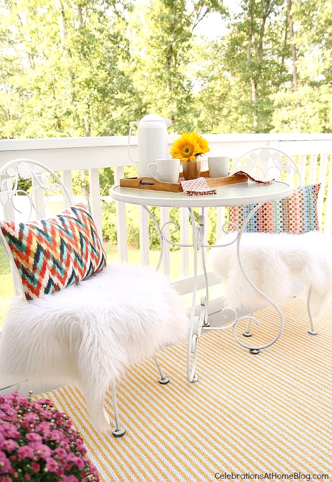 bistro table and chairs on small deck