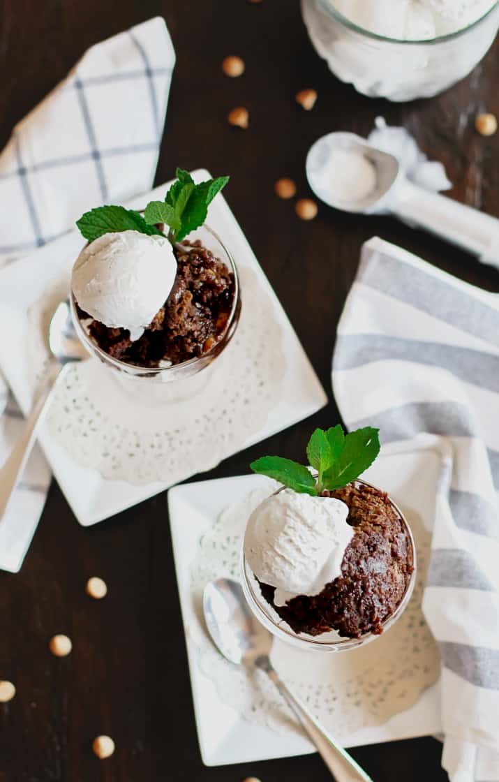 Slow cooker brownie cake topped with ice cream, overhead view