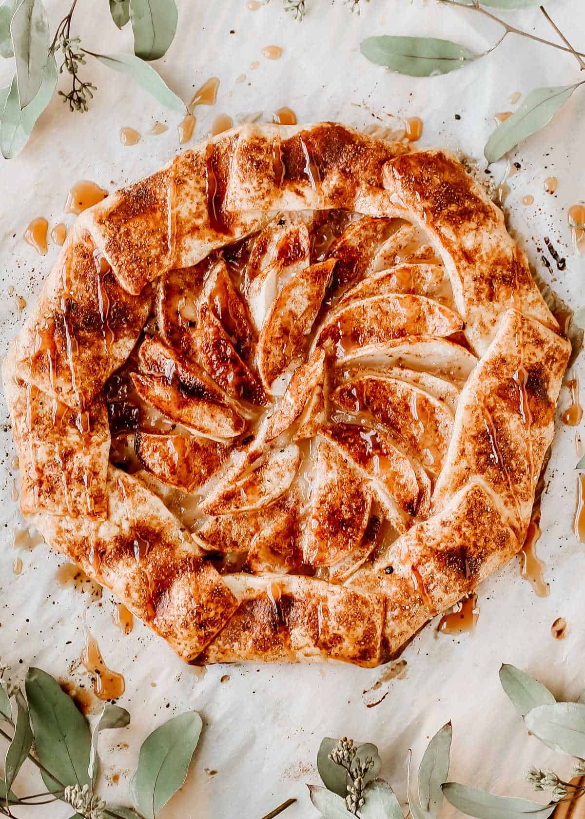 galette dessert with apples and cinnamon, overhead view.
