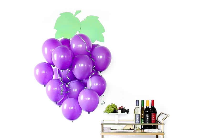 purple balloons in a cluster to look like grapes.