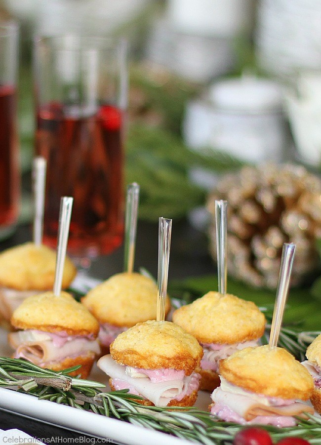 Party appetizers - Mini muffin appetizers turn into sandwiches with turkey, brie, and cranberry-cream cheese spread
