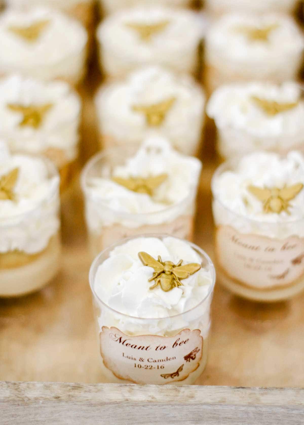 mini desserts in jars, topped by candy bee.