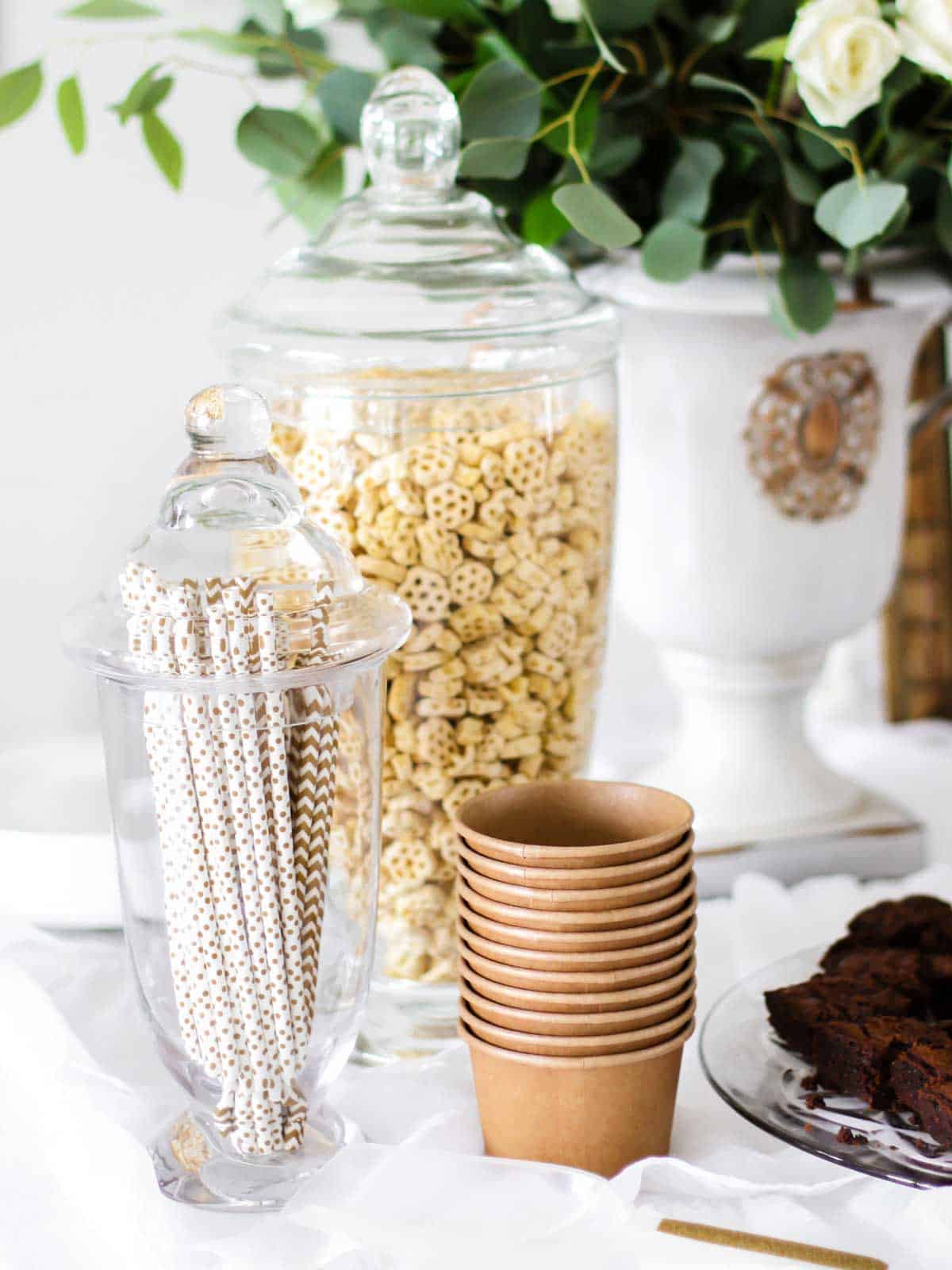 Honeycomb cereal in glass jar, on party table.