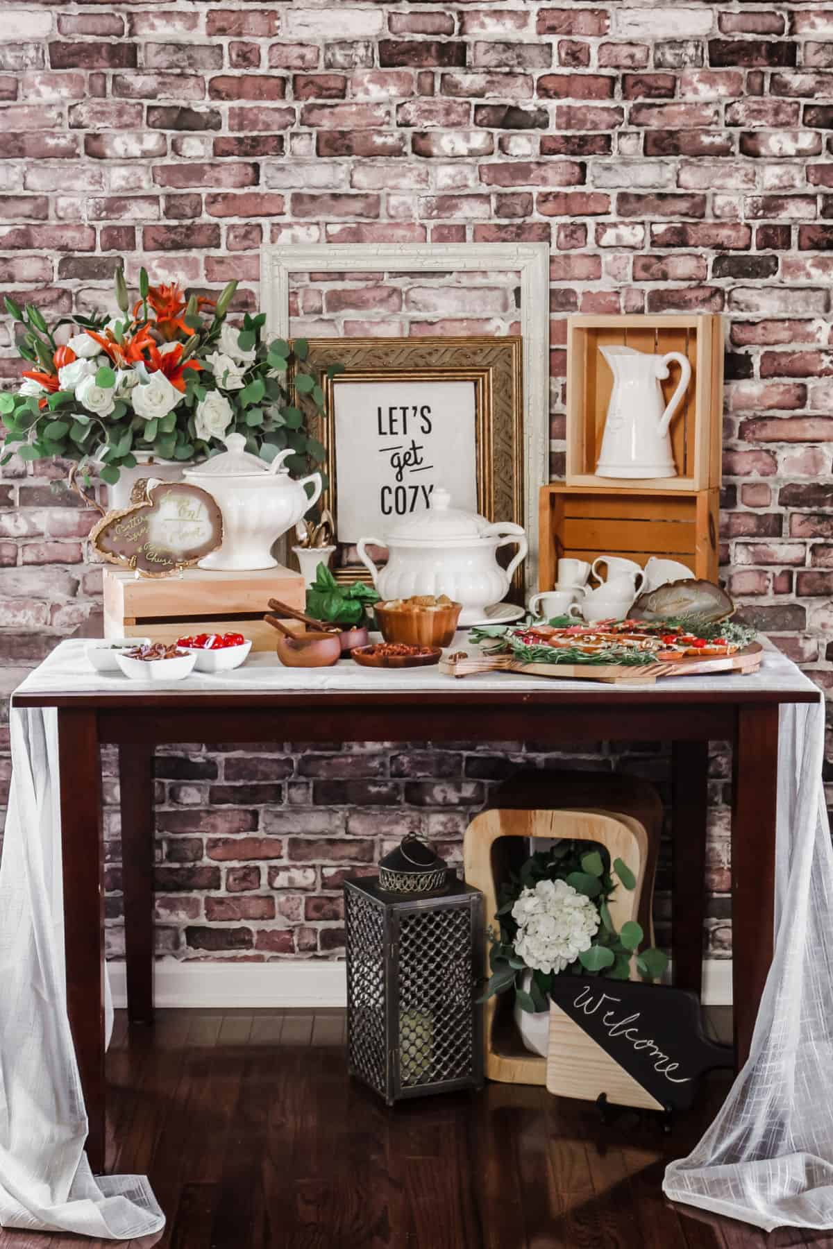 soup bar party with flowers, toppings, soup tureens, and frames