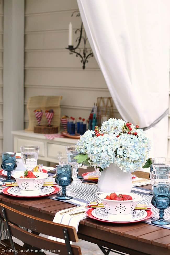 Celebrate the 4th of July with a red white & blue party! Get inspired with these photos and tips from entertaining expert, Chris Nease of Celebrations At Home. #july4th #4thofjuly #summervibes #patioparty 4th of July table setting and decor