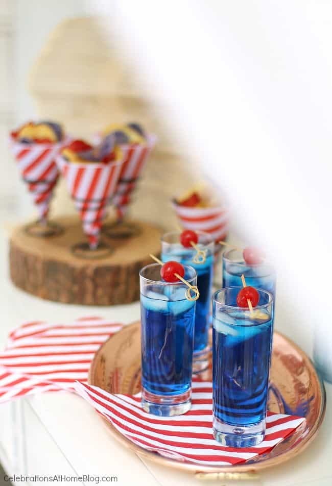 Celebrate the 4th of July with a red white & blue party! Set up a July 4th bar with a blue cocktail. see more here. #cocktail #bluecocktail #4thofjuly #july4th #summerparty #bar blue party cocktail