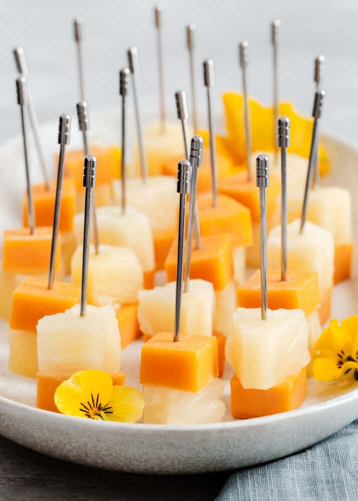 cheese and pineapple cubes on picks.