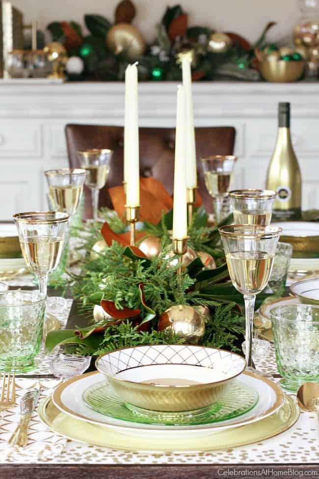 Green & gold Christmas tablescape end place setting with greenery and candlestick centerpiece runner